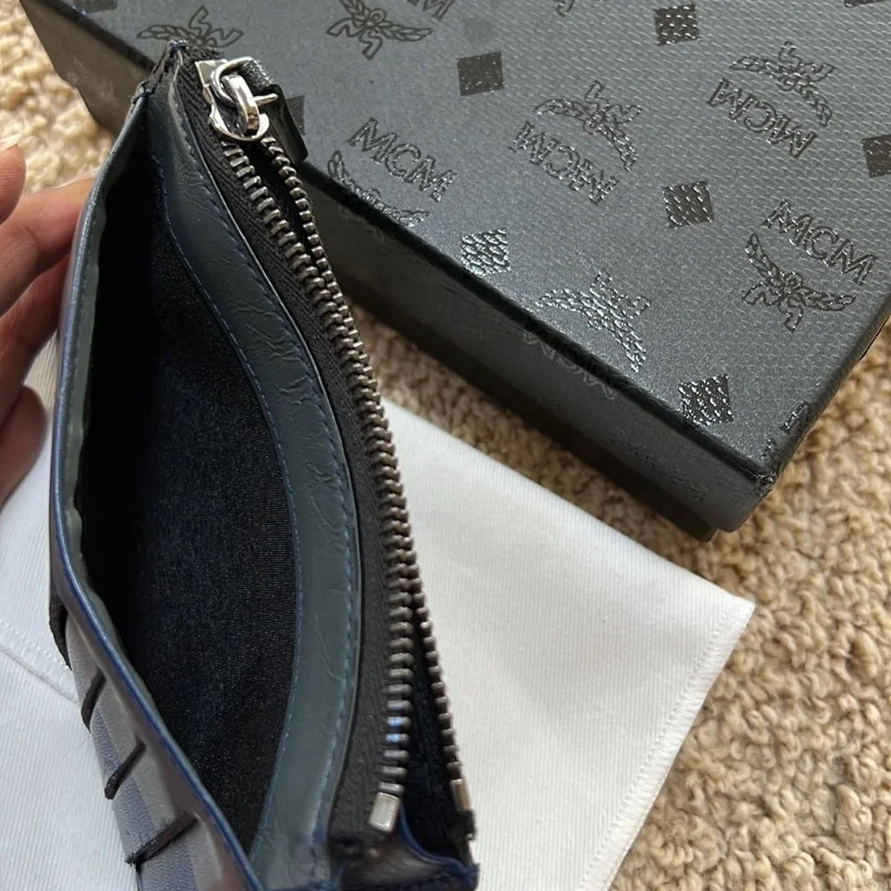 MCM men's lion embossed black with blue and grey mini zipped coin card holder